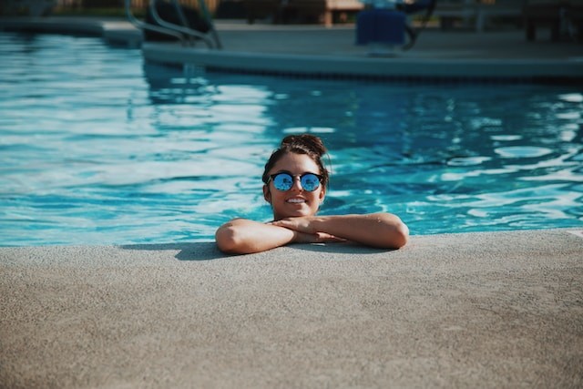 person smiling from the pool