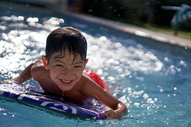 young boy in pool