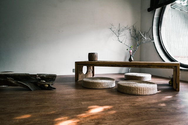 brown-wooden-bench-near-window